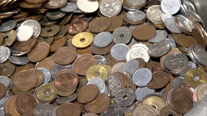 ゆうちょ銀行 硬貨預け入れに手数料 ATMでは1枚から110円~