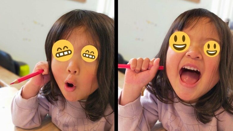 お地蔵様が彫られた鉛筆を使って大爆笑する娘さん