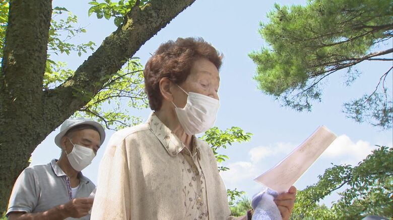 歌を唄う西村さん