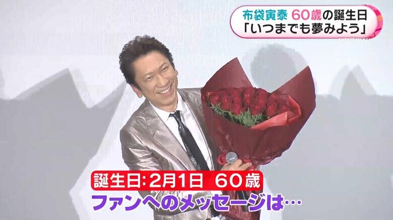 布袋寅泰さん 深紅のバラがお似合い