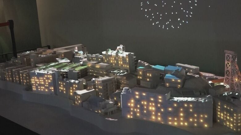 プロジェクションマッピングとAIで当時の建物の様子と人の動きを再現したコーナー（軍艦島デジタルミュージアム）