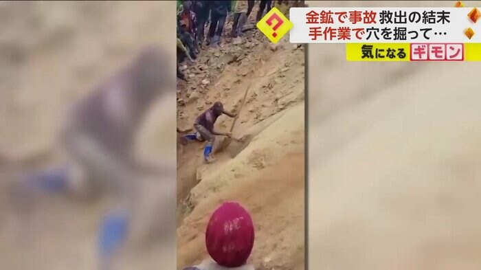 道具を使って穴を掘る男性