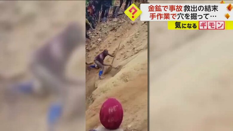 道具を使って穴を掘る男性