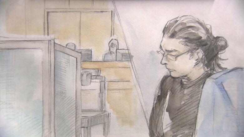 母親の証人尋問時の山上被告　母親はついたての中で話す