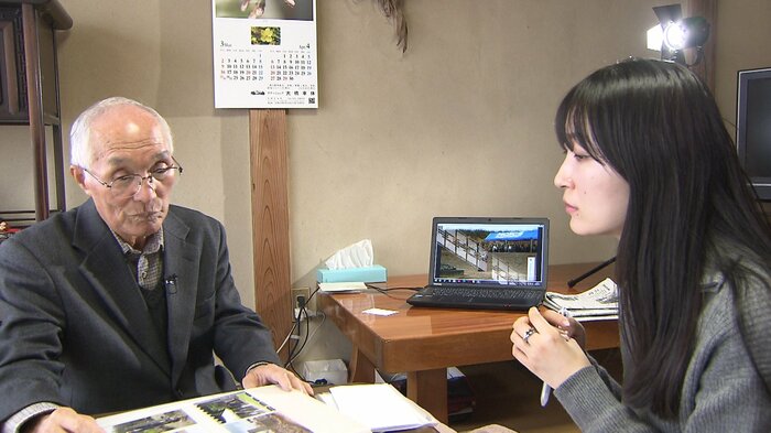 筆者の取材に応じる高橋春男さん