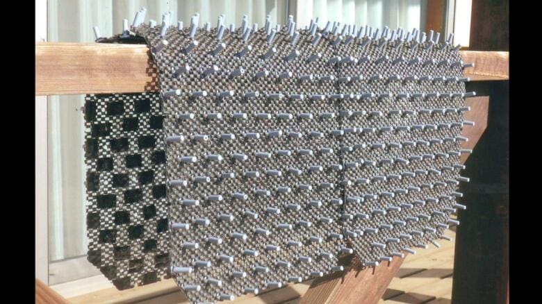 「物干し補助具」使用例（提供：婦人発明家協会）