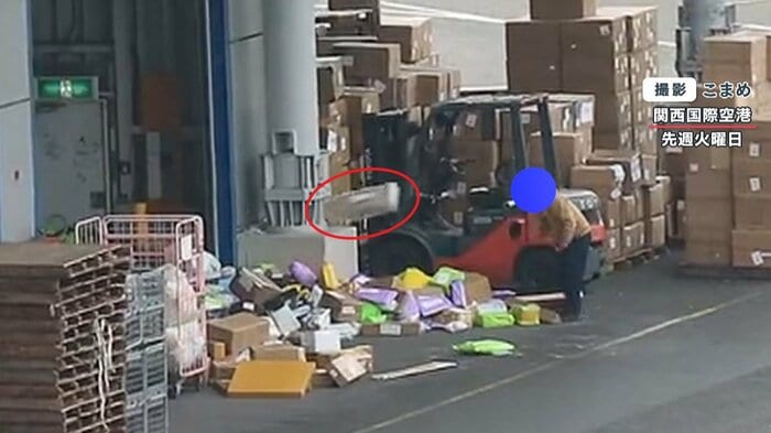 大きな荷物もおかまいなしに放り投げる作業員