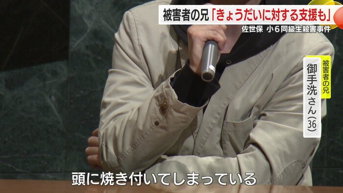 講演する御手洗さん