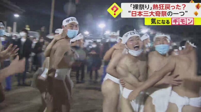 記者に興奮を伝える参加者