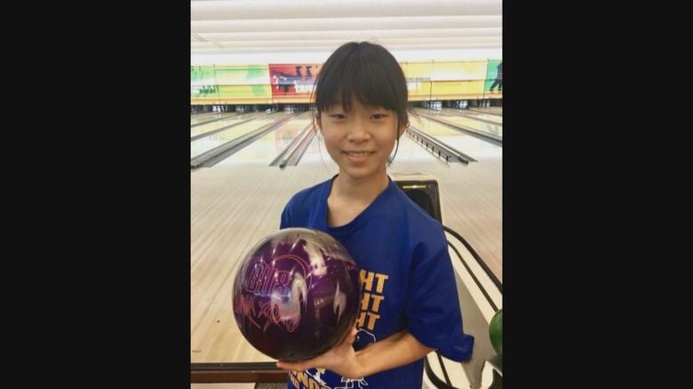 12歳のころの佐藤さん（手に持っているのが両親にねだったボール）