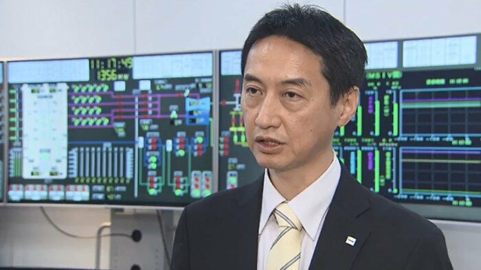 長谷川学フェロー 背後はシミュレーション画面